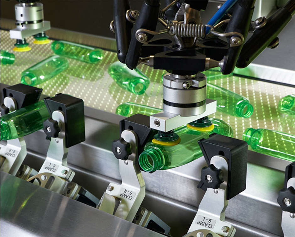 Packfeeder's machine on duty with different bottles on unscrambling