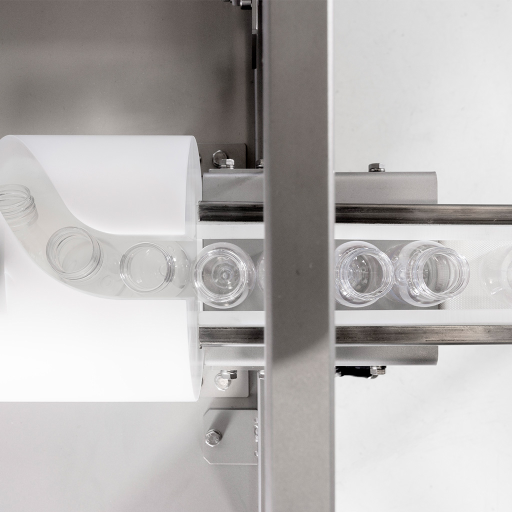 Rotzinger Group - Close up from above of Packfeeder's bottle cleaning solution 